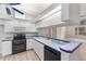Modern kitchen with stainless steel appliances and breakfast bar at 11661 Sw 70Th Ct, Ocala, FL 34476