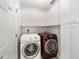 Laundry room with washer, dryer, and ample cabinet storage at 11661 Sw 70Th Ct, Ocala, FL 34476