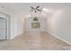 Spacious living room featuring vaulted ceilings and wood-look flooring at 11661 Sw 70Th Ct, Ocala, FL 34476