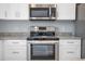 Stainless steel microwave and range with granite countertops at 12560 Sw 80 St, Dunnellon, FL 34432