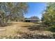 Spacious backyard with a large grassy area, ideal for outdoor activities at 15330 Sw 59Th Ct, Ocala, FL 34473