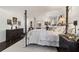 Spacious bedroom with dark wood floors and a metal bed frame at 15330 Sw 59Th Ct, Ocala, FL 34473