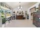 Charming dining room with a chandelier and antique furniture at 15330 Sw 59Th Ct, Ocala, FL 34473