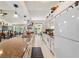 Modern kitchen with granite countertops and white cabinetry at 15330 Sw 59Th Ct, Ocala, FL 34473