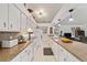 Kitchen boasts granite counters and white cabinets at 15330 Sw 59Th Ct, Ocala, FL 34473