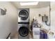 Laundry area with stackable washer and dryer at 15330 Sw 59Th Ct, Ocala, FL 34473