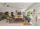 Bright living room with eclectic decor, comfy seating, and large windows at 15330 Sw 59Th Ct, Ocala, FL 34473