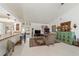 Living area with eclectic decor, comfortable seating, and view to kitchen at 15330 Sw 59Th Ct, Ocala, FL 34473