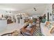 Spacious living room with a view of the kitchen and access to the backyard at 15330 Sw 59Th Ct, Ocala, FL 34473