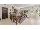 Eclectic living room with hardwood floors, unique furniture, and access to the kitchen at 15330 Sw 59Th Ct, Ocala, FL 34473
