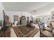 Spacious living area featuring a cozy sitting area and eclectic decor at 15330 Sw 59Th Ct, Ocala, FL 34473