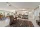 Open concept living room with kitchen views and comfortable seating at 15330 Sw 59Th Ct, Ocala, FL 34473
