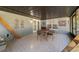 Screened porch with seating area and access to backyard at 15330 Sw 59Th Ct, Ocala, FL 34473