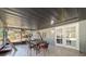 Screened porch with table, chairs, and access to backyard at 15330 Sw 59Th Ct, Ocala, FL 34473