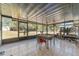 Spacious screened porch with table and chairs, overlooking backyard at 15330 Sw 59Th Ct, Ocala, FL 34473