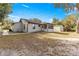 House exterior view showcasing a ramp and detached garage at 17757 Se 28Th Ln, Silver Springs, FL 34488