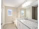 Bathroom with granite countertop and shower at 22160 Sw Neptune Blvd, Dunnellon, FL 34431