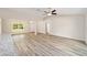 Open concept living room with kitchen island and neutral tones at 22160 Sw Neptune Blvd, Dunnellon, FL 34431