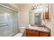 Clean bathroom with a vanity, shower, and toilet at 24 Banyan Dr, Ocala, FL 34472