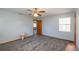 Spacious bedroom featuring carpet, ceiling fan and natural light at 24 Banyan Dr, Ocala, FL 34472