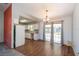 Bright dining area with wood-look floors and sliding glass doors leading outside at 24 Banyan Dr, Ocala, FL 34472