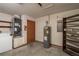 Garage with water heater and storage shelves at 24 Banyan Dr, Ocala, FL 34472