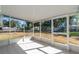 Bright screened porch overlooking the backyard at 24 Banyan Dr, Ocala, FL 34472