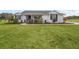 White house with black shutters, front porch, and manicured lawn at 3440 Ne 56Th St, Ocala, FL 34479