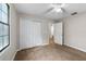 Bedroom with double-door closet and carpet flooring at 3931 Se 80Th St, Ocala, FL 34480