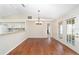 Bright dining room with hardwood floors and access to the kitchen at 5327 Sw 89Th St, Ocala, FL 34476