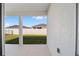 Covered back patio overlooks grassy backyard at 6071 Sw 93Rd Loop, Ocala, FL 34476
