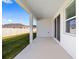 Covered patio with sliding glass doors and a view of the backyard at 6071 Sw 93Rd Loop, Ocala, FL 34476