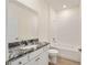 Clean bathroom with granite countertop and a bathtub at 6071 Sw 93Rd Loop, Ocala, FL 34476