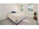 Cozy bedroom with neutral decor and two windows at 6071 Sw 93Rd Loop, Ocala, FL 34476