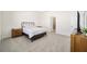 Bright bedroom featuring a comfortable bed and ample floor space at 6071 Sw 93Rd Loop, Ocala, FL 34476