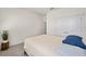 Well-lit bedroom with double doors leading to a closet at 6071 Sw 93Rd Loop, Ocala, FL 34476