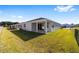 Single story home with covered patio and grassy yard at 6071 Sw 93Rd Loop, Ocala, FL 34476