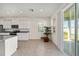 Bright kitchen with view to backyard and sliding doors at 6071 Sw 93Rd Loop, Ocala, FL 34476