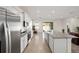 Open concept kitchen with granite countertops and stainless steel appliances at 6071 Sw 93Rd Loop, Ocala, FL 34476