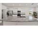 Kitchen boasts a large granite island and stainless steel appliances at 6071 Sw 93Rd Loop, Ocala, FL 34476