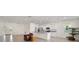 Open concept kitchen with granite countertops and stainless steel appliances at 6071 Sw 93Rd Loop, Ocala, FL 34476