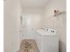 Laundry room with washer, dryer, and overhead shelving at 6071 Sw 93Rd Loop, Ocala, FL 34476