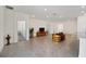 Open concept living room with tile floors and access to other rooms at 6071 Sw 93Rd Loop, Ocala, FL 34476