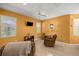 Relaxing living room with a ceiling fan and plenty of natural light at 7947 Sw 83Rd Pl, Ocala, FL 34476