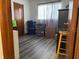 Simple bedroom with gray vinyl flooring and wooden closet at 8152 Sw 106Th St, Ocala, FL 34481