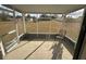 Enclosed patio with concrete flooring and a chair, overlooking yard at 8152 Sw 106Th St, Ocala, FL 34481