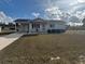 One-story home with gray siding, driveway, and small front yard at 8152 Sw 106Th St, Ocala, FL 34481