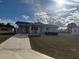 Front view of a single-story house with a concrete driveway at 8152 Sw 106Th St, Ocala, FL 34481