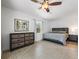 Spacious bedroom with tiled floors and a ceiling fan at 965 Nw 73Rd Ter, Ocala, FL 34482