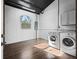 Bright laundry room with washer, dryer, and tile floor at 965 Nw 73Rd Ter, Ocala, FL 34482